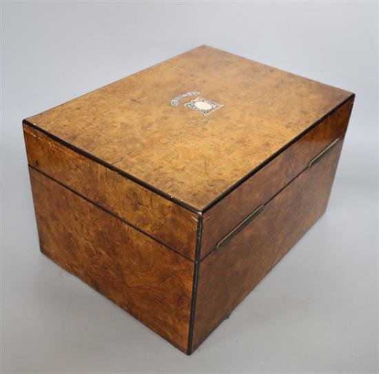 A Victorian walnut and abalone-inlaid toilet box containing plate-mounted fitments, 31cm wide